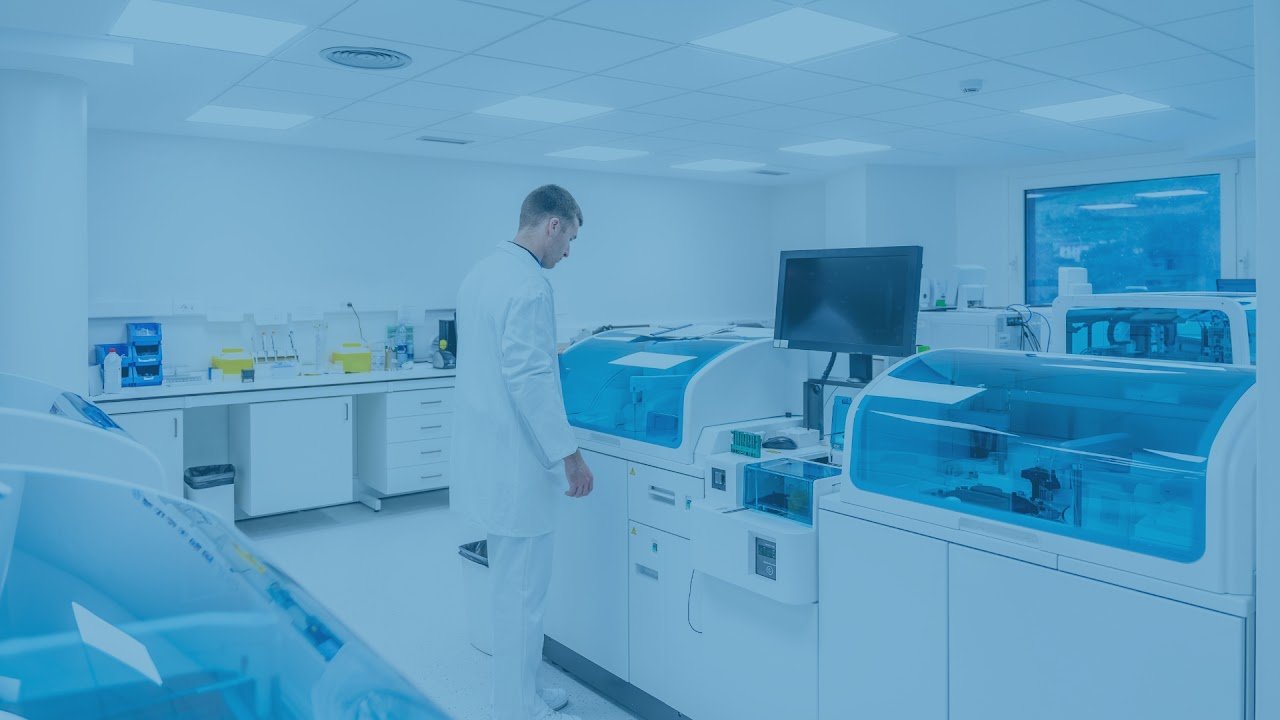 Technician operating diagnostic lab equipment at Superhealth Diagnostics Center